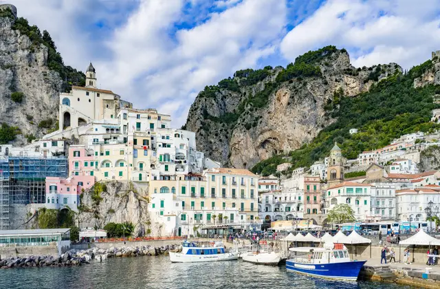 The pier at Amalfi with ferries and excursion boats moored alongside