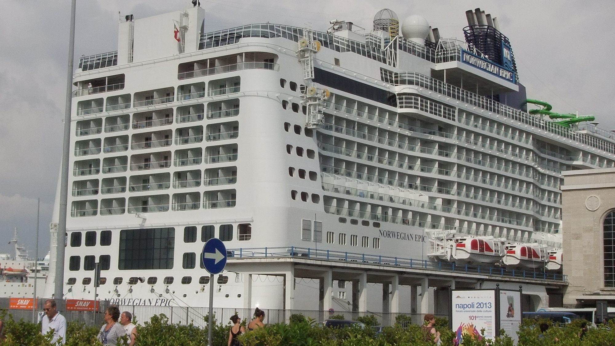 Cruise ship moored alongside the quay in the port of Salerno with the coast behind