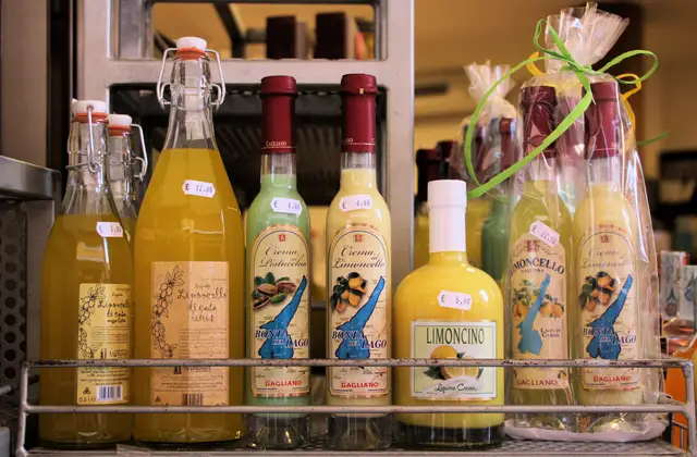 Bottles of limoncello and glasses on a terrace table on the Amalfi Coast