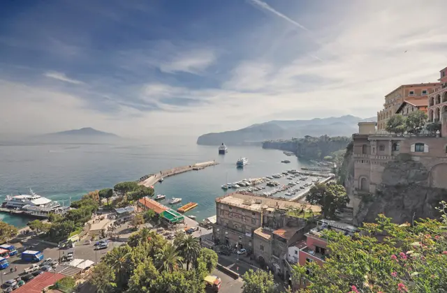 Marina Piccola in Sorrento with hydrofoils and ferries moored below the tuff cliff