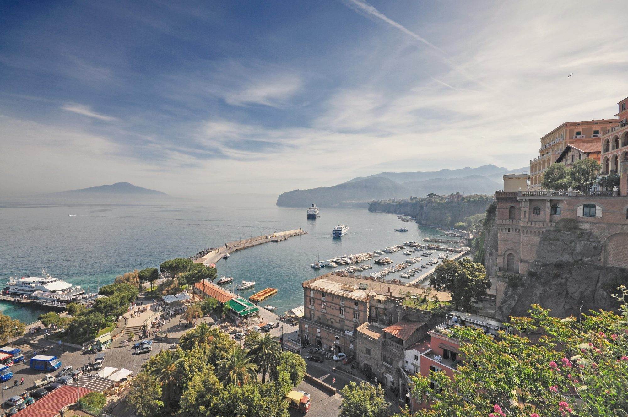 Marina Piccola in Sorrento with hydrofoils and ferries moored below the tuff cliff